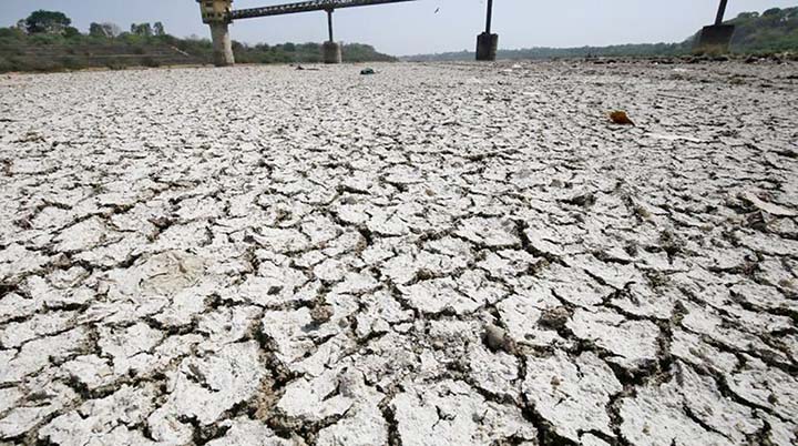 A water pump shed is seen in the dried-up portion of the Sabarmati river on a hot day on the outskirts of Ahmedabad, India.