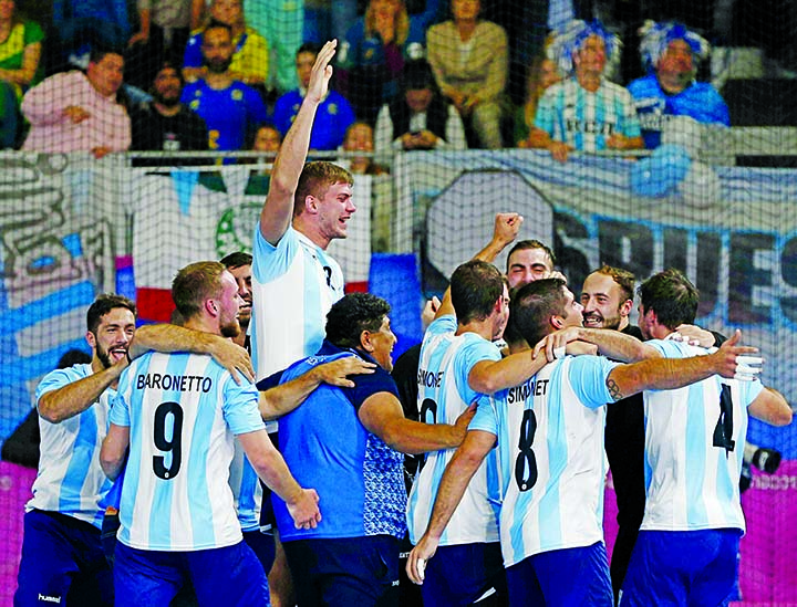 Argentina's players celebrate after winning the gold medal against Chile in the men's handball final game at the Pan American Games in Lima Peru on Monday.