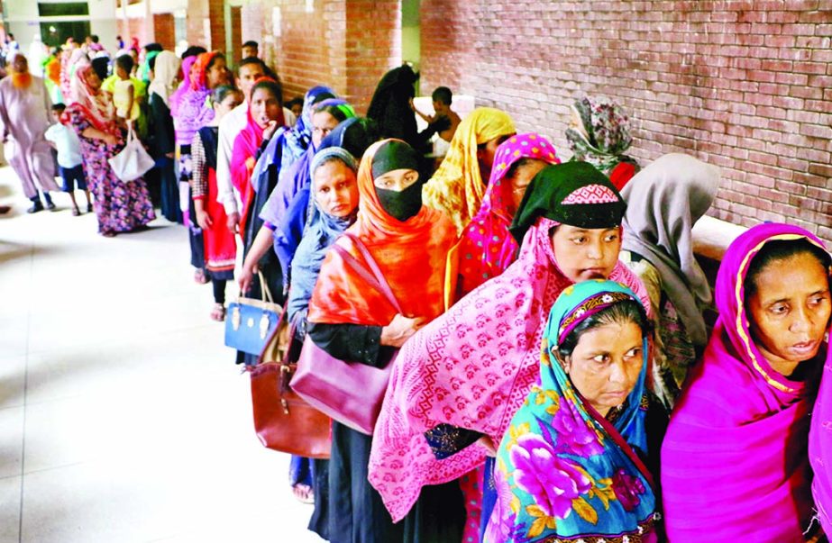 With the government hospitals reeling under pressure of patients amid a worst ever dengue outbreak, treatment seekers form a long queue at the out patient department (OPD) of the Shaheed Suhrawardy Medical College Hospital in the capital on Tuesday.