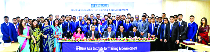 A Rouf Chowdhury, Chairman of Bank Asia Limited, poses for photo session with the participants of its 51st Foundation Training Course held at its Training Institute in the city recently.