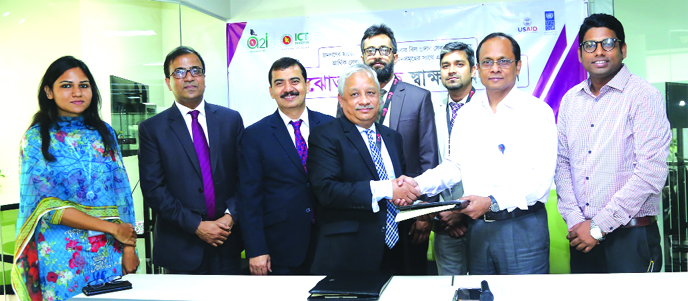 Arif Quadri, AMD of United Commercial Bank Limited and Dr. Md Abdul Mannan, Project Director of a2i project, exchanging an agreement signing document at the banks head office in the city recently. Under the deal, the bank will provide financial services t