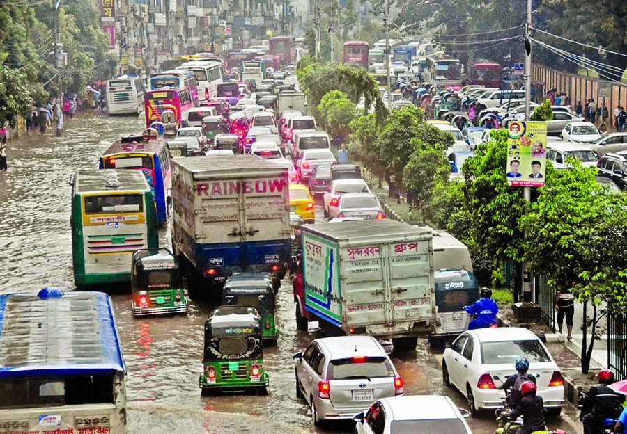 Thousands of vehicles got stuck in a massive traffic gridlock across the capital due to water logging as heavy rains inundated all streets across the capital, causing untold sufferings to commuters. This photo was taken from near Shapla Chattar at Motijhe