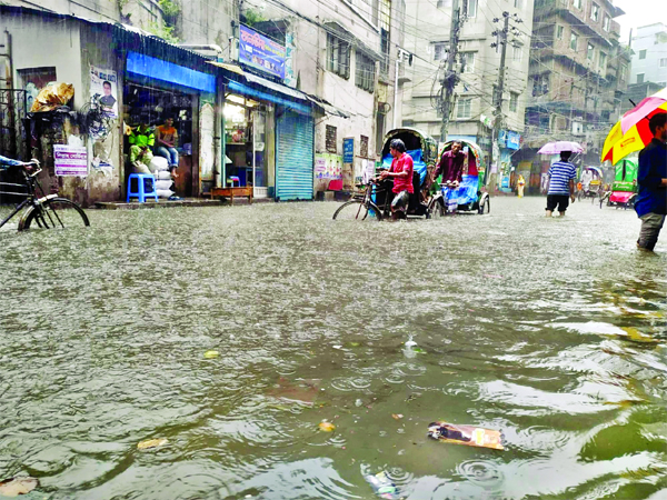 Heavy rains inundated cityâ€™s Aga Sadeq Road on Thursday causing immense suffering to the people .