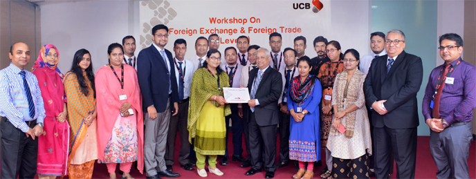 Arif Quadri, AMD of United Commercial Bank Limited, handing over certificates among the participants of training on 'Advanced Workshop on Foreign Exchange & Foreign Trade' at its training centre in the city recently. Abul Ali Ahad, Head of the Centre al