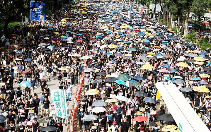 Anti-extradition demonstrators march to call for democratic reforms in Hong Kong.