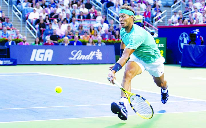 . Rafael Nadal of Spain, runs for the ball to return to Fabio Fognini of Italy, during quarter-finals play at the Rogers Cup tennis tournament in Montreal on Friday.