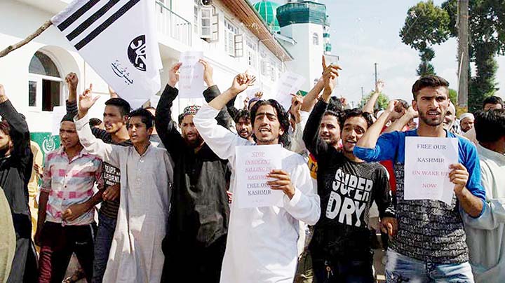 Kashmiri Muslims shout slogans during a protest after Eid prayers in Srinagar, Indian-controlled Kashmir.