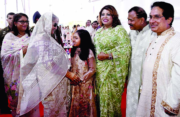 Prime Minister Sheikh Hasina exchanging pleasantries with diplomats, government officials, party colleagues and people from all walks of life at Ganabhaban on Monday on the occasion of holy Eid-ul-Azha.