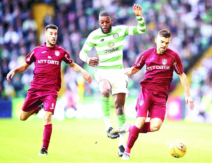 Celtic's Olivier Ntcham (centre) battles for the ball with Cluj's Luis Aurelio (left) and Mateo Susic (right) during the UEFA Champions League third qualifying round second leg match at Celtic Park, Glasgow on Tuesday.