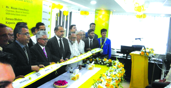 Nizam Chowdhury, Chairman of the Board of Directors of NRB Global Bank Ltd, inaugurating the banks' 58th branch by cutting ribbon at Kapasia Upazila in Gazipur recently. Managing Director Syed Habib Hasnat, Branch Manager Nazrul Islam and Kapasia Police