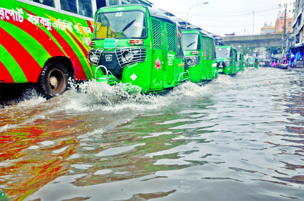 Major roads of the capital once again submerged with rainwater on Thursday, causing inconveniences and sufferings to the people. This photo was taken from city's Bango Bazar area.