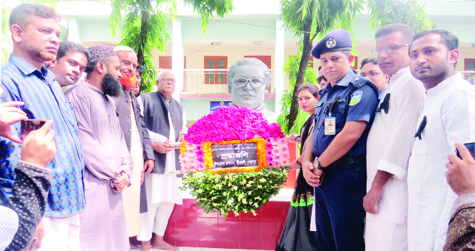 SREEBARDI (Sherpur): Alhaj A K M Fazlul Huq MP placing wreaths at the monument of Bangabandhu in observance of the National Mourning Day on Thursday..