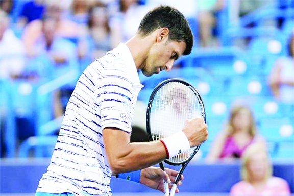 Novak Djokovic of Serbia, reacts during a match against Pablo Carreno Busta of Spain, at the Western & Southern Open tennis tournament in Mason, Ohio on Thursday.