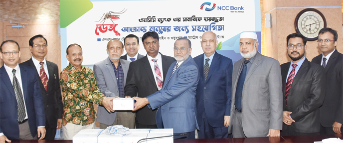 Md Nurun Newaz Salim, Chairman of NCC Bank, handing over dengue identification kits to the high Official of National Medical College & Hospital at a ceremony at the bank's Head Office recently. Managing Director Mosleh Uddin Ahmed, Deputy Managing Direct