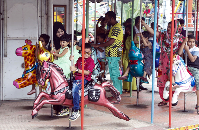 Children at the recreation center yet after Eid holidays. The snap was taken from the city's Shishu Mela on Friday.