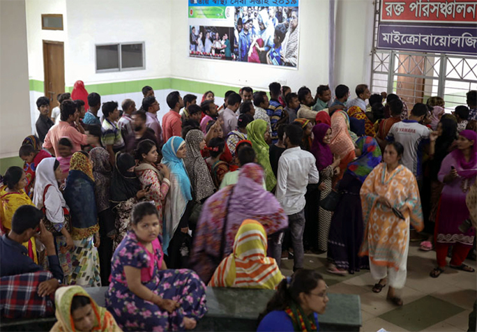 Dengue patients crowded different hospitals in the city for blood test. The snap was taken from Mugda General Hospital on Friday.