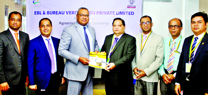 Ahsan Ullah Chowdhury, Head of Cards and Digital Banking of Eastern Bank Limited (EBL) and Engr Ahsan Habib, Chairman, Board of Trustees and International University of Scholars (IUS), exchanging an agreement signing document at the bank's head office in