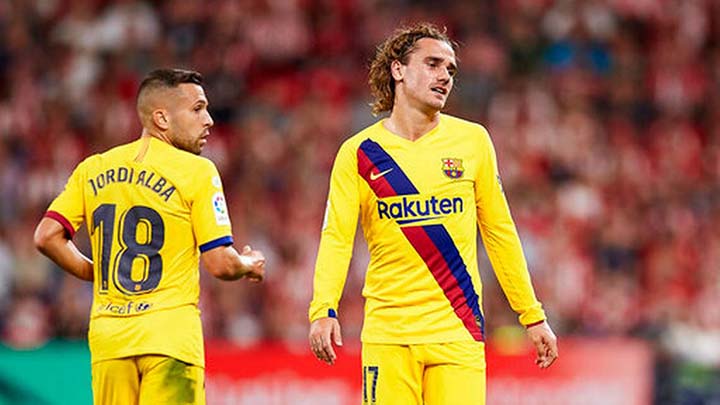 Barcelona's Antoine Griezmann (right) reacts during the Spanish La Liga soccer match between Athletic Bilbao and FC Barcelona at San Mames stadium in Bilbao, northern Spain on Friday. Barcelona lost to Bilbao 1-0.