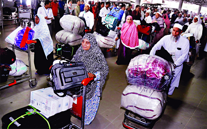 First batch of returning Hajj pilgrims on their arrival at Hazrat Shahjalal International Airport on Saturday.
