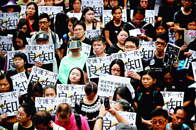 Teachers protest against the extradition bill during a rally organised by Hong Kong Professional Teachers' Union in Hong Kong, China on Saturday.