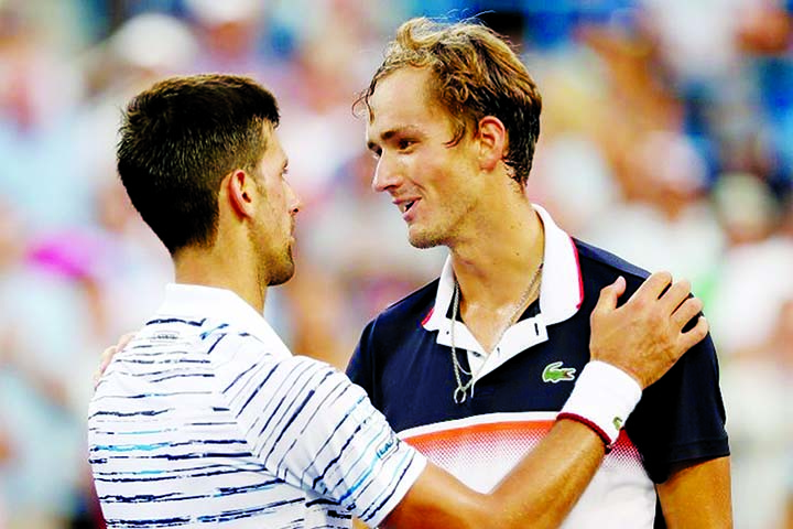 World number one Novak Djokovic (left) of Serbia, congratulates Daniil Medvedev after falling to the Russian in the semi-finals of the ATP Cincinnati Masters at Cincinnati on Saturday.