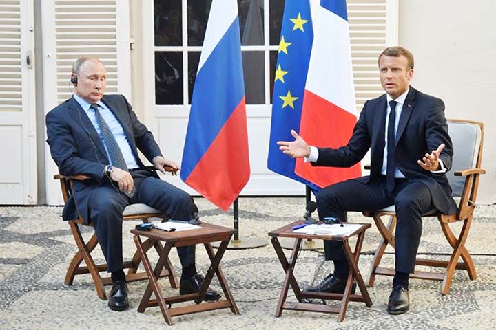 French President Emmanuel Macron Â® meets with Russia's President Vladimir Putin, at his summer retreat of the Bregancon fortress on the Mediterranean coast, near the village of Bormes-les-Mimosas, southern France