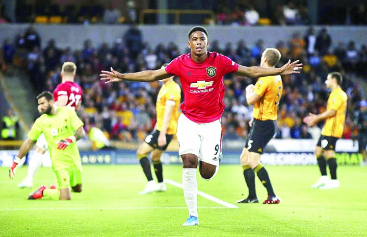 Manchester United's Anthony Martial celebrates scoring his side's first goal of the game during the Premier League match against Wolverhampton, at Molineux, Wolverhampton on Monday.