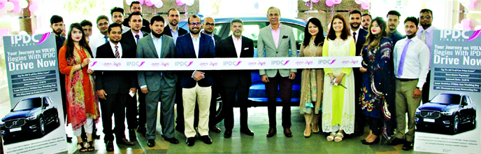 Mominul Islam, CEO of IPDC Finance Limited and Hossain Khaled, Managing Director of Anwar Group Limited inaugurating the Volvo showcase offer at IPDC office premises in the city recently. IPDC jointly brought the auto loan offer with world-renowned automo