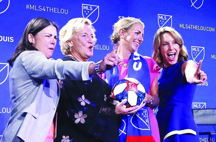 The ownership group of the new St. Louis soccer franchise poses for a photo after the announcement on Tuesday that St. Louis has been awarded a major league soccer expansion team. They are from left: Patty Taylor, Jo Ann Taylor Kindle, Carolyn Kindl