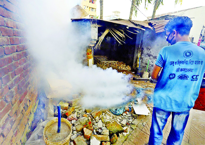 A Dhaka North City Corporation (DNCC) employee with a fogger spraying the newly imported insecticide at Mirpur in city on Wednesday in an effort to kill Aedes mosquitoes.