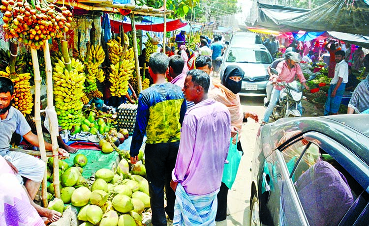 An unauthorized weekly kitchen market set up at Meradia adjacent to Banasree residential area at Rampura in city on Wednesday causing huge inconveniences to the residents and motorists as the busy road being narrowed down.