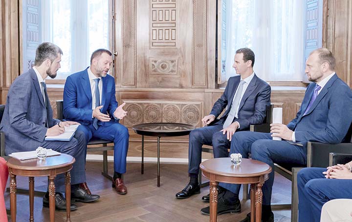 Syrian President Bashar Assad, second right, meets with a Russian delegation in Damascus, Syria on Tuesday