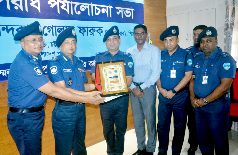 Noor -E -Alam Mina, SP ,Chattogram receiving best District Award from DIG Chattogram Range Khandoker Golam Faruque at District Police Lines on Tuesday.