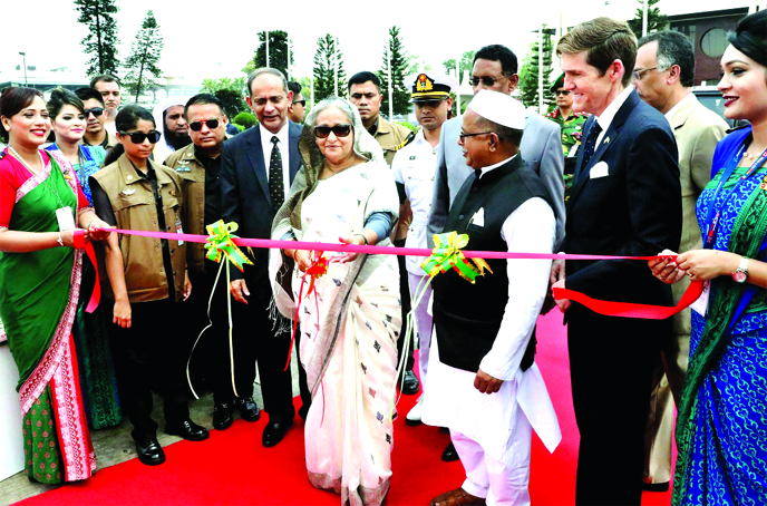 Prime Minister Sheikh Hasina, inaugurating the commercial flight of Biman's third Boeing 787-8 Dreamliner "Gangchil" by cutting ribbon at Hazrat Shahjalal International Airport on Thursday.