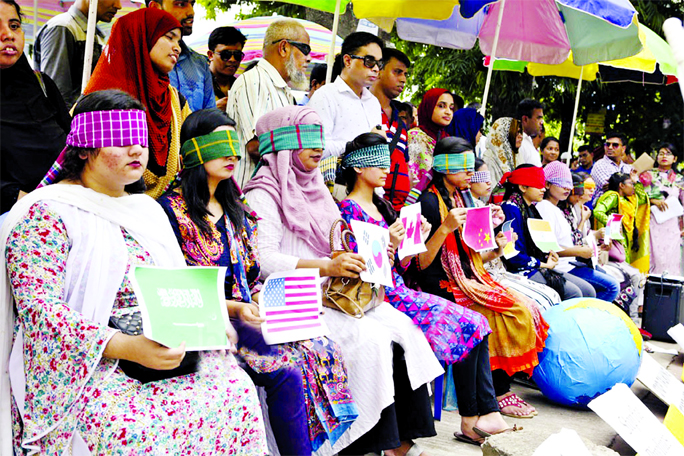 Blind folded activists of 'Youth Climate Network' gather in front of Dhanmondi Abahani playground demanding for climate action in Bangladesh. This photo was taken on Thursday.