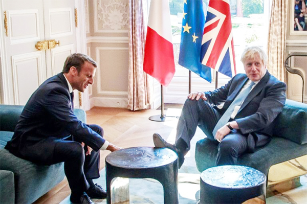 Johnson met Macron at the Elysee palace where he was pictured putting his foot on a table.