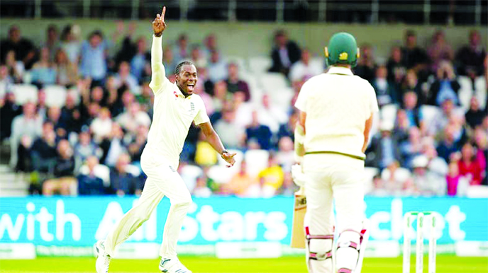 England's Jofra Archer celebrates after taking his 5th wicket, that of Australia's Pat Cummins (right) caught by Jonny Bairstow for 0 on the first day of the 3rd Ashes Test at Headingley in Leeds, England, on Thursday.