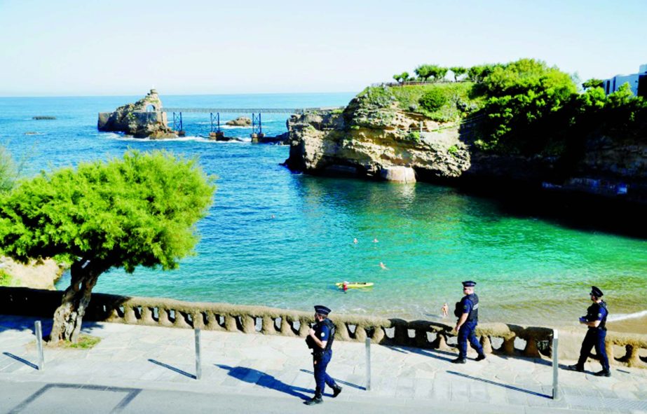 French CRS police patrol in Biarritz, as the resort city is locked down ahead of the G7 summit.