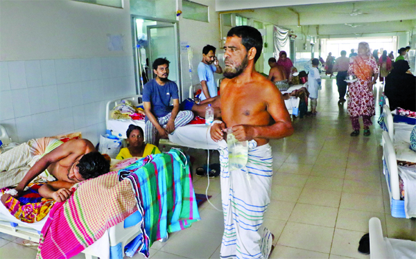 A dengue patient who is undergoing treatment at Mitford Hospital heading towards a doctor for taking better treatment as no doctors and nurses are seen attending patients regularly.