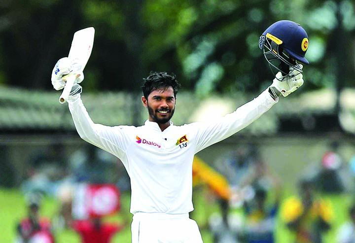 Dhananjaya de Silva of Sri Lanka, celebrates his century on day three of the rain-hit second Test between Sri Lanka and New Zealand, in Colombo on Saturday.