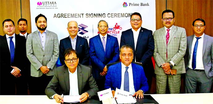 ANM Mahfuz, Head of Consumer Banking Division of Prime Bank Limited and ABM Humayun Kabir, Director (Finance & Administration) of Uttara Motors Limited, pose for photograph after signing a deal at the banks head office in the city on Sunday. Under the dea