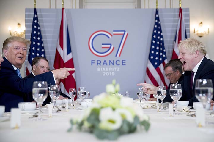 U.S. President Donald Trump, (left), and Britain's Prime Minister Boris Johnson attend a working breakfast at the Hotel du Palais on the sidelines of the G-7 Summit in Biarritz, France on Sunday.