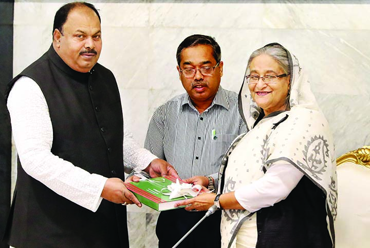 State Minister for Primary and Mass Education Zakir Hossain handing over workplan for five years term to Prime Minister Sheikh Hasina at the seminar room of the cabinet of the PMO on Monday. BSS photo