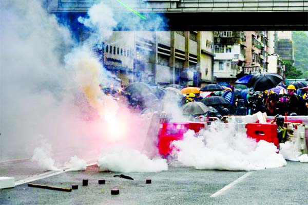 Police fire tear gas during a protest in Tsuen Wan district of Hong Kong.
