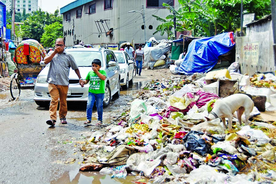 DCCs recently taken steps to clean various parts of the Dhaka city to control dengue outbreak but the garbage dumped on many streets still remain unattended for days. This photo was taken from Arambagh Culvert Road on Monday.
