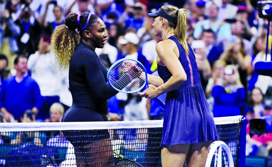 Serena Williams (left) of the United States, shakes hands with Maria Sharapova of Russia, after their first round match at the U.S. Open tennis tournament in New York on Monday.