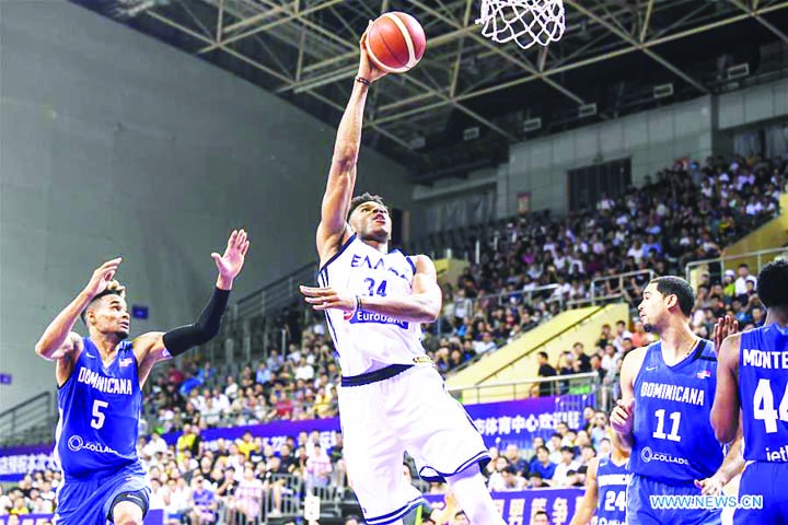 Giannis Antetokounmp (2nd left) of Greece shoots during a match against the Dominican Republic at the 2019 Suzhou International Basketball Challenge in Suzhou, East China's Jiangsu Province on Monday.