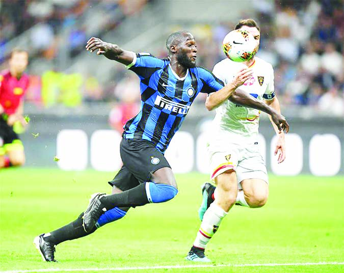 Inter Milan's Romelu Lukaku (left) vies with Lecce's Fabio Lucioni during a Serie A soccer match between Inter Milan and Lecce in Milan, Italy on Monday.