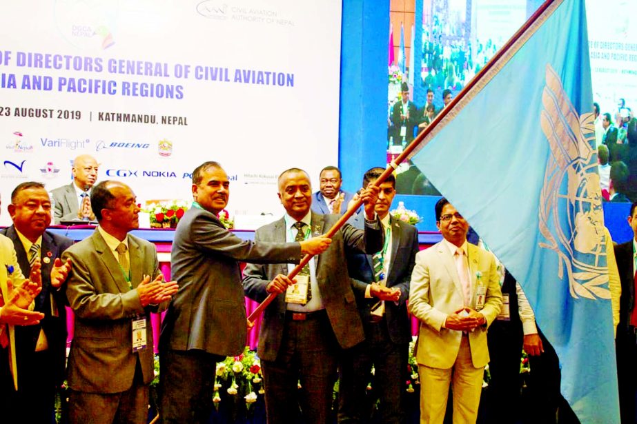 A delegation led by Bangladesh Civil Aviation Authority Chairman Air Vice Marshal M Mafidur Rahman hoisting the flag of 56th conference of the Director General of Civil Aviation (DGCA) of Asia Pacific region held in Kathmandu of Nepal on Monday.