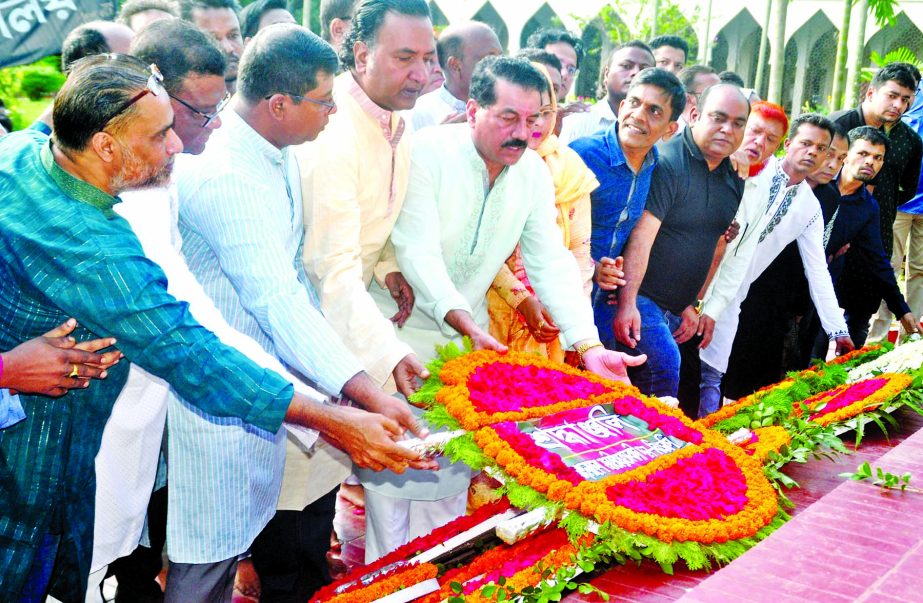 BNP Joint Secretary General Khairul Kabir Khokon along with party colleagues placing wreaths on the Mazar of National Poet Kazi Nazrul Islam at Dhaka University area on Tuesday marking the 43rd death anniversary of the poet.